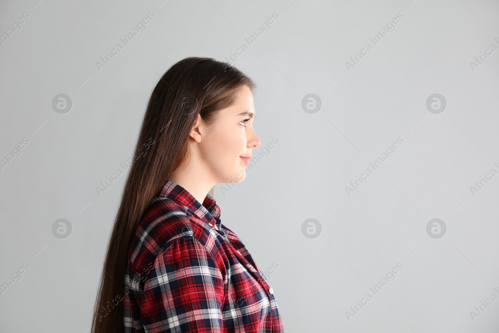 Photo of Portrait of young woman on light background