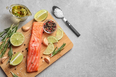 Fresh salmon and ingredients for marinade on table, top view