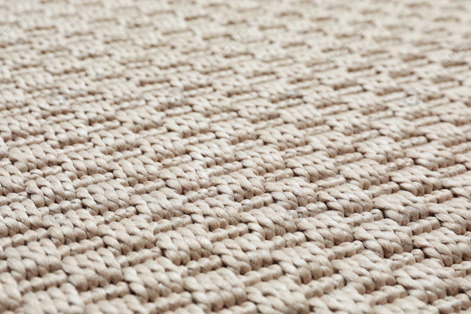 Photo of Beige woven carpet texture as background, closeup