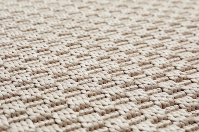 Photo of Beige woven carpet texture as background, closeup