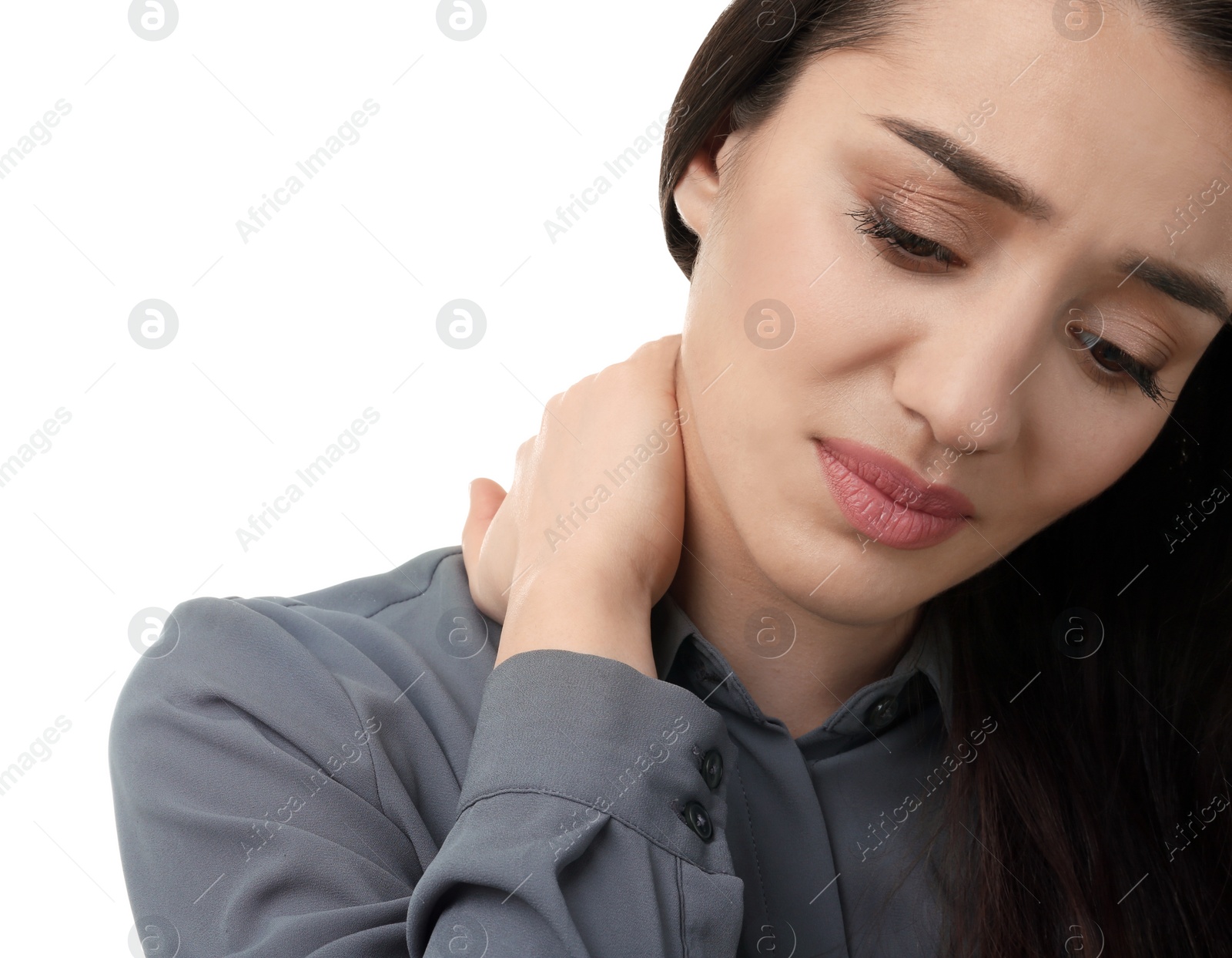 Photo of Young woman suffering from pain in neck on white background