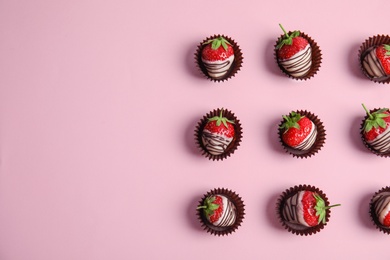 Photo of Flat lay composition with chocolate covered strawberries on color background