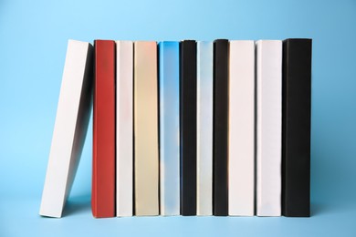 Collection of books on light blue background