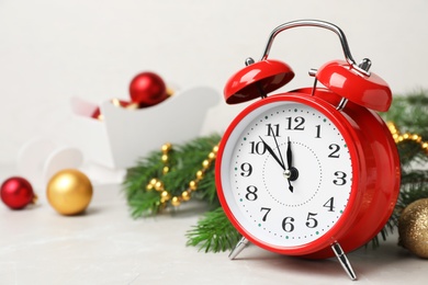 Retro alarm clock and decor on table. Christmas countdown