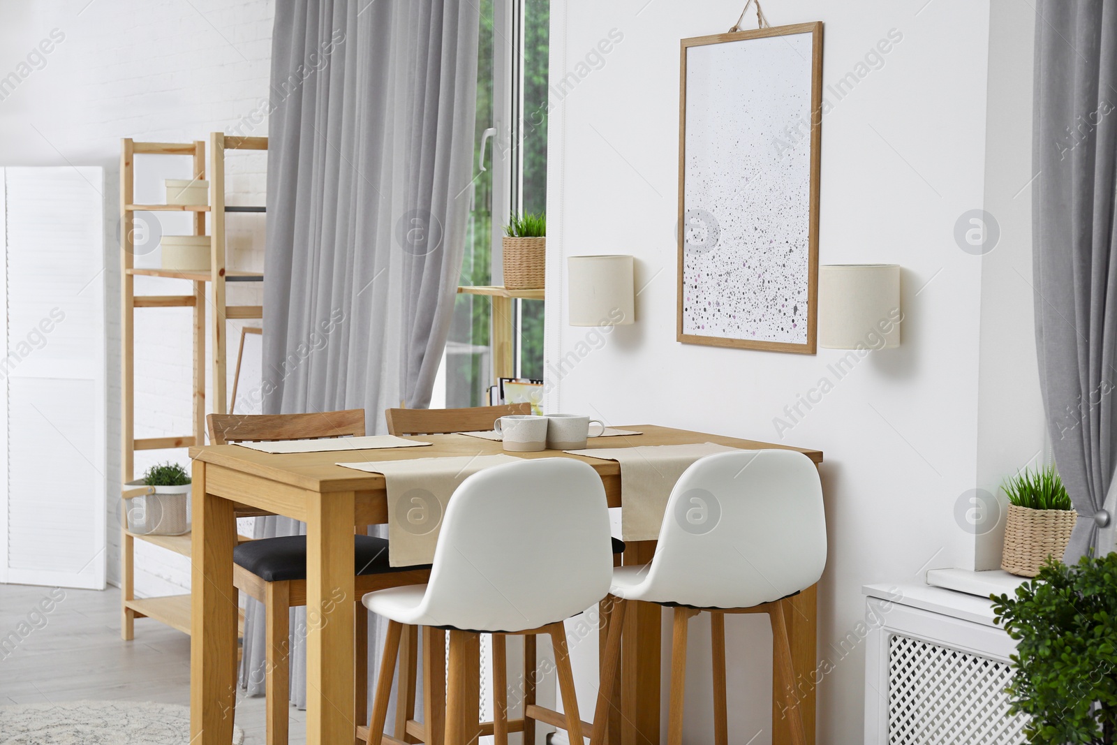 Photo of Modern room interior with wooden dining table