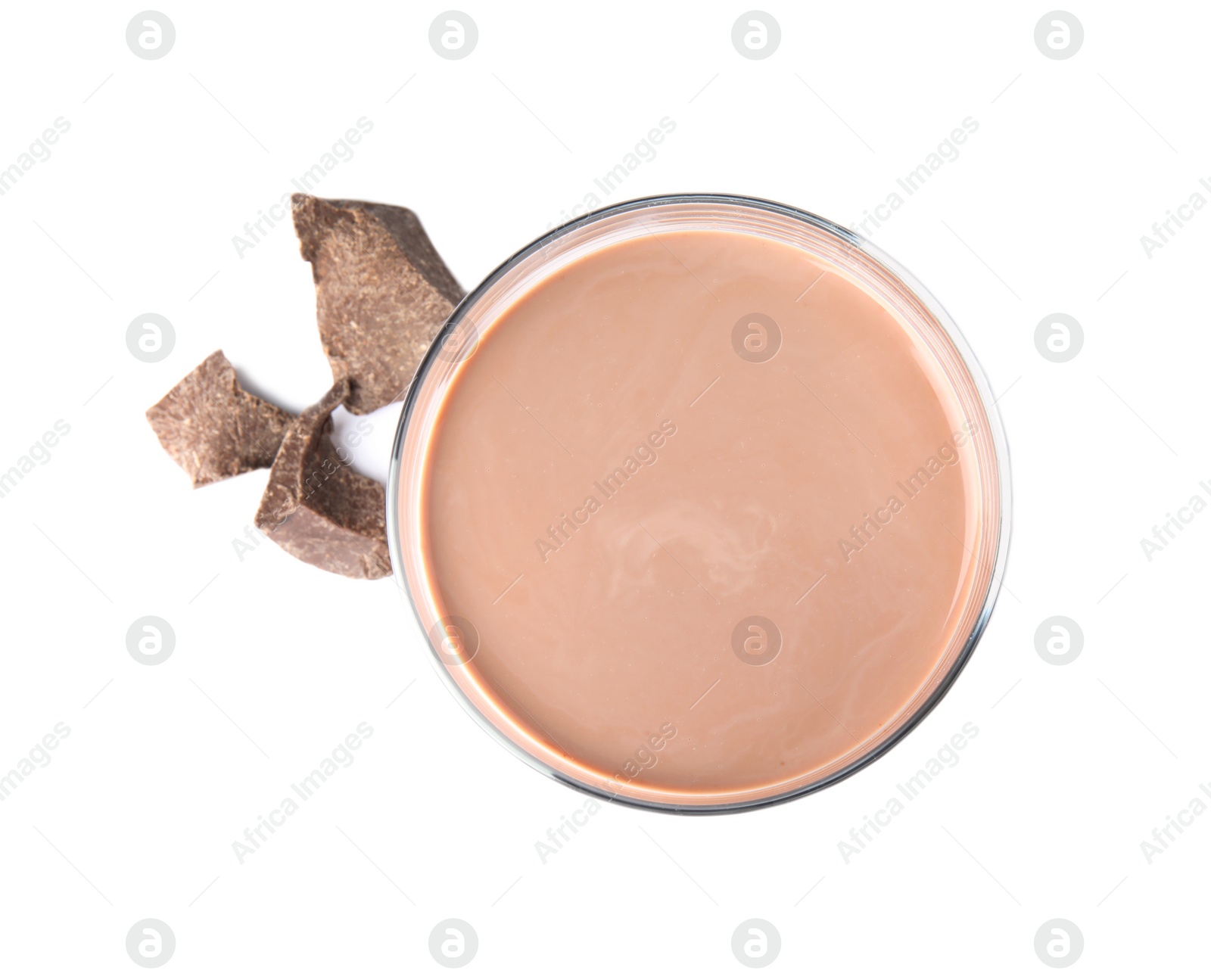 Photo of Glass with tasty chocolate milk on white background, top view. Dairy drink