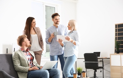 Photo of Business people discussing work matters in office, space for text. Professional communication