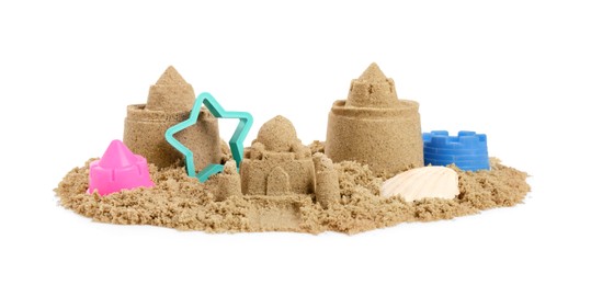 Photo of Pile of sand with beautiful castles, plastic toys and shell isolated on white