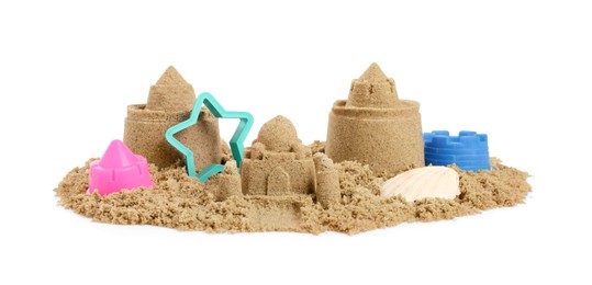 Pile of sand with beautiful castles, plastic toys and shell isolated on white