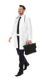 Photo of Full length portrait of male doctor with briefcase isolated on white. Medical staff