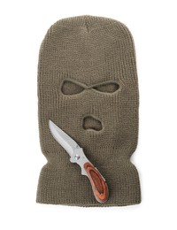 Photo of Beige knitted balaclava and knife on white background, top view