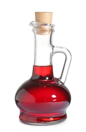 Photo of Glass jug with wine vinegar on white background