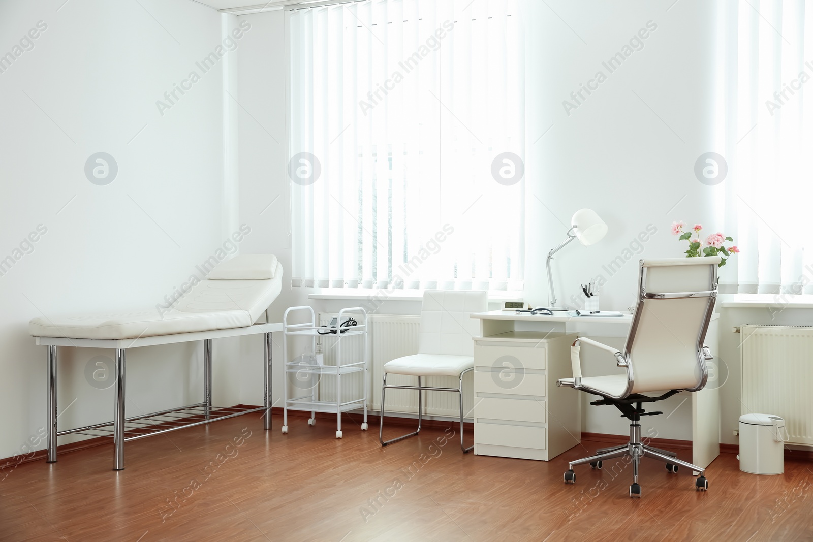 Photo of Interior of modern medical office. Doctor's workplace