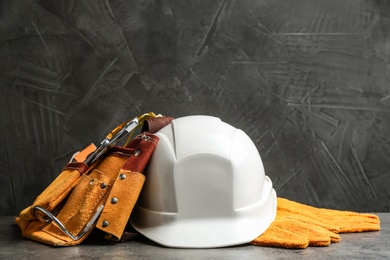 Photo of Composition with construction tools on grey table, space for text