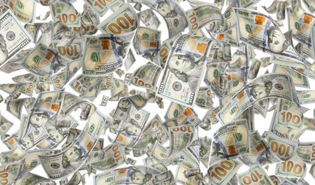 Image of Many American dollars on white background. Flying money