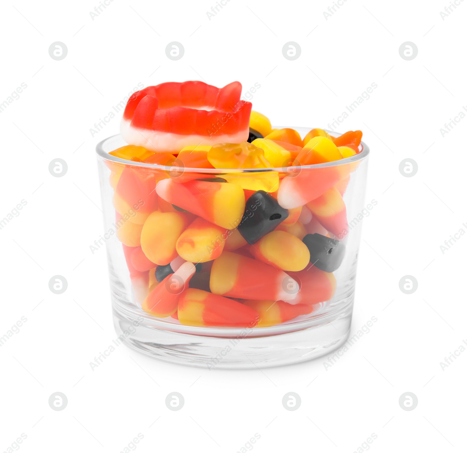 Photo of Glass bowl of delicious colorful candies isolated on white. Halloween sweets