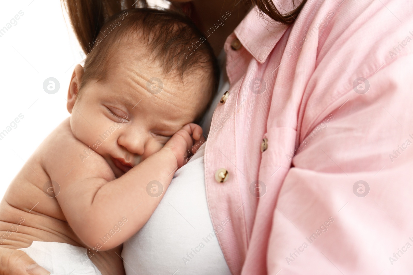 Photo of Young mother with her little baby on light background