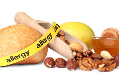 Photo of Allergenic food. Different fresh products with tape on white background