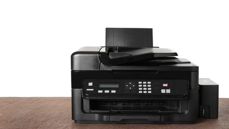 Photo of New modern multifunction printer on brown table