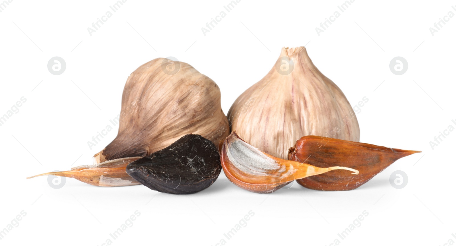 Photo of Aged black garlic on white background. Asian cuisine