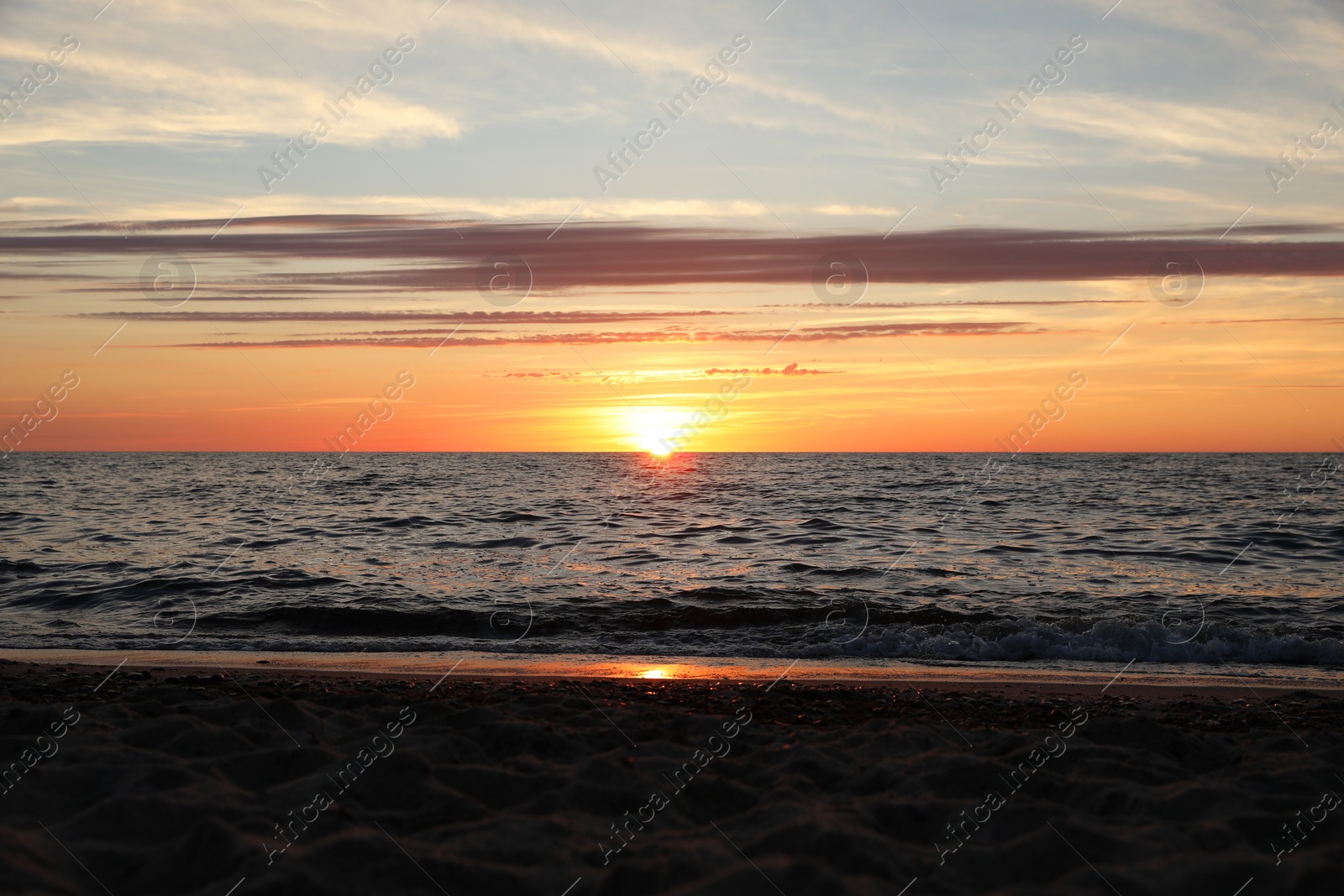 Photo of Picturesque view of sea at sunset. Tropical beach