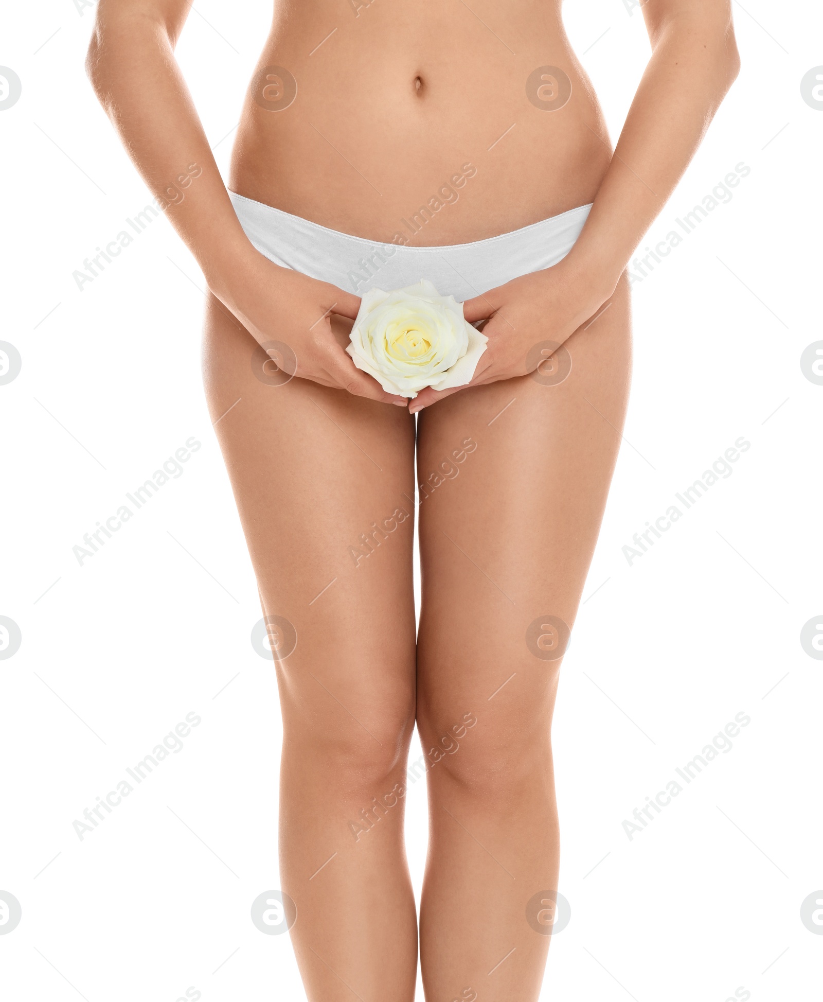 Photo of Woman with rose showing smooth skin on white background, closeup. Brazilian bikini epilation