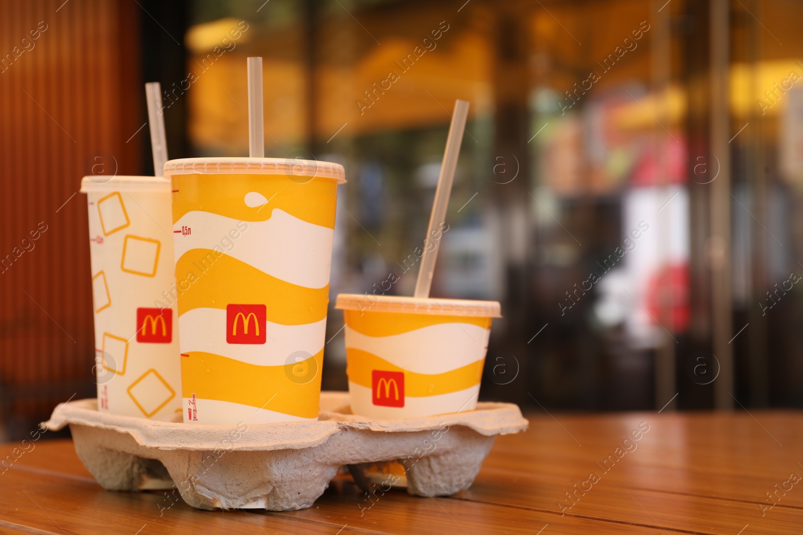 Photo of MYKOLAIV, UKRAINE - AUGUST 11, 2021: Cold McDonald's drinks on table in cafe