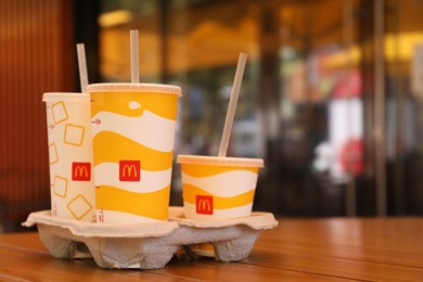 Photo of MYKOLAIV, UKRAINE - AUGUST 11, 2021: Cold McDonald's drinks on table in cafe