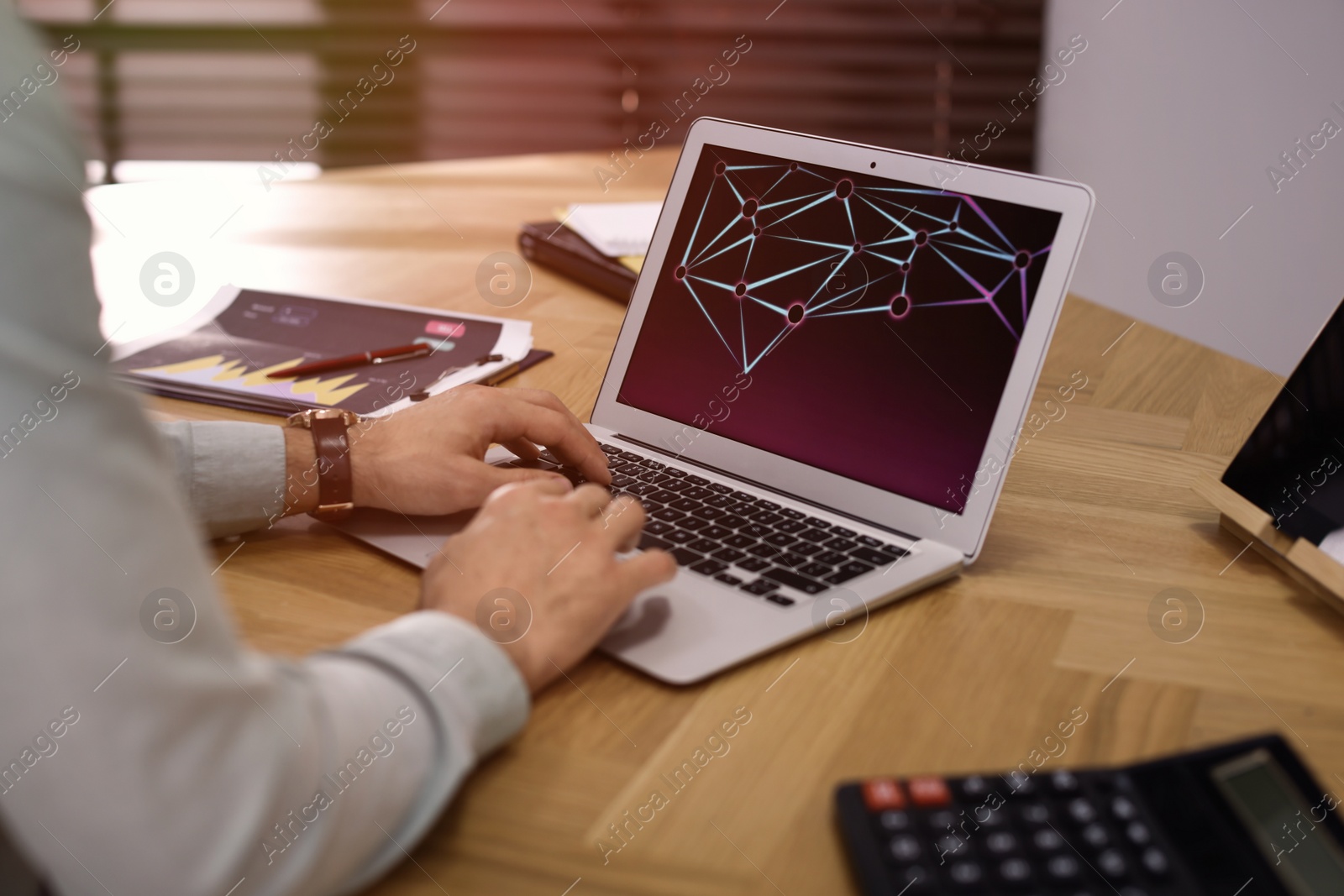 Photo of Businessman working with laptop in office, closeup. Forex trading