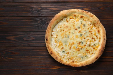 Photo of Delicious cheese pizza on wooden table, top view. Space for text