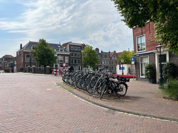 Photo of Beautiful viewparking with bicycles and buildings on city street