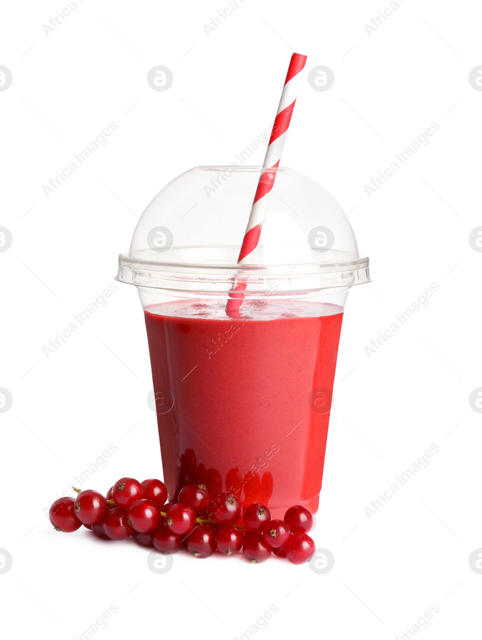 Photo of Plastic cup of tasty currant smoothie and fresh fruits on white background