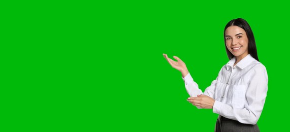 Image of Chroma key compositing. Broadcaster against green screen, banner design