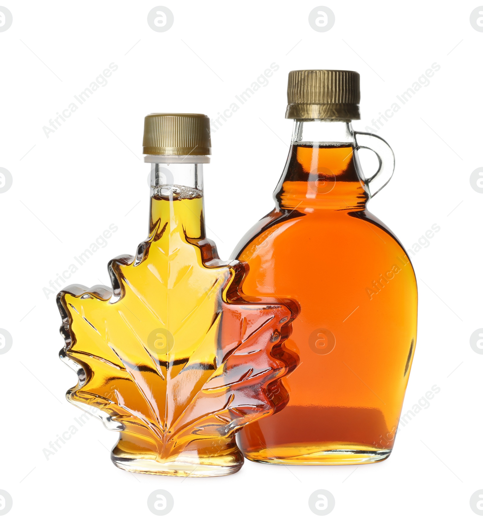 Photo of Different bottles of tasty maple syrup on white background