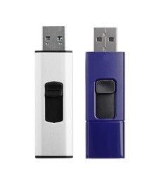 Photo of Modern usb flash drives on white background, top view