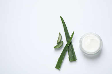 Open jar of cream and aloe isolated on white, top view. Organic cosmetics