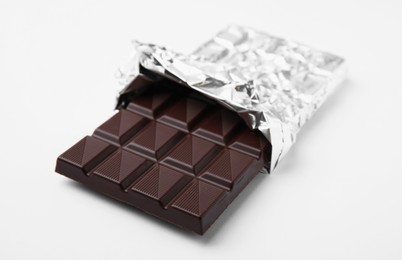 Photo of One tasty chocolate bar on white background