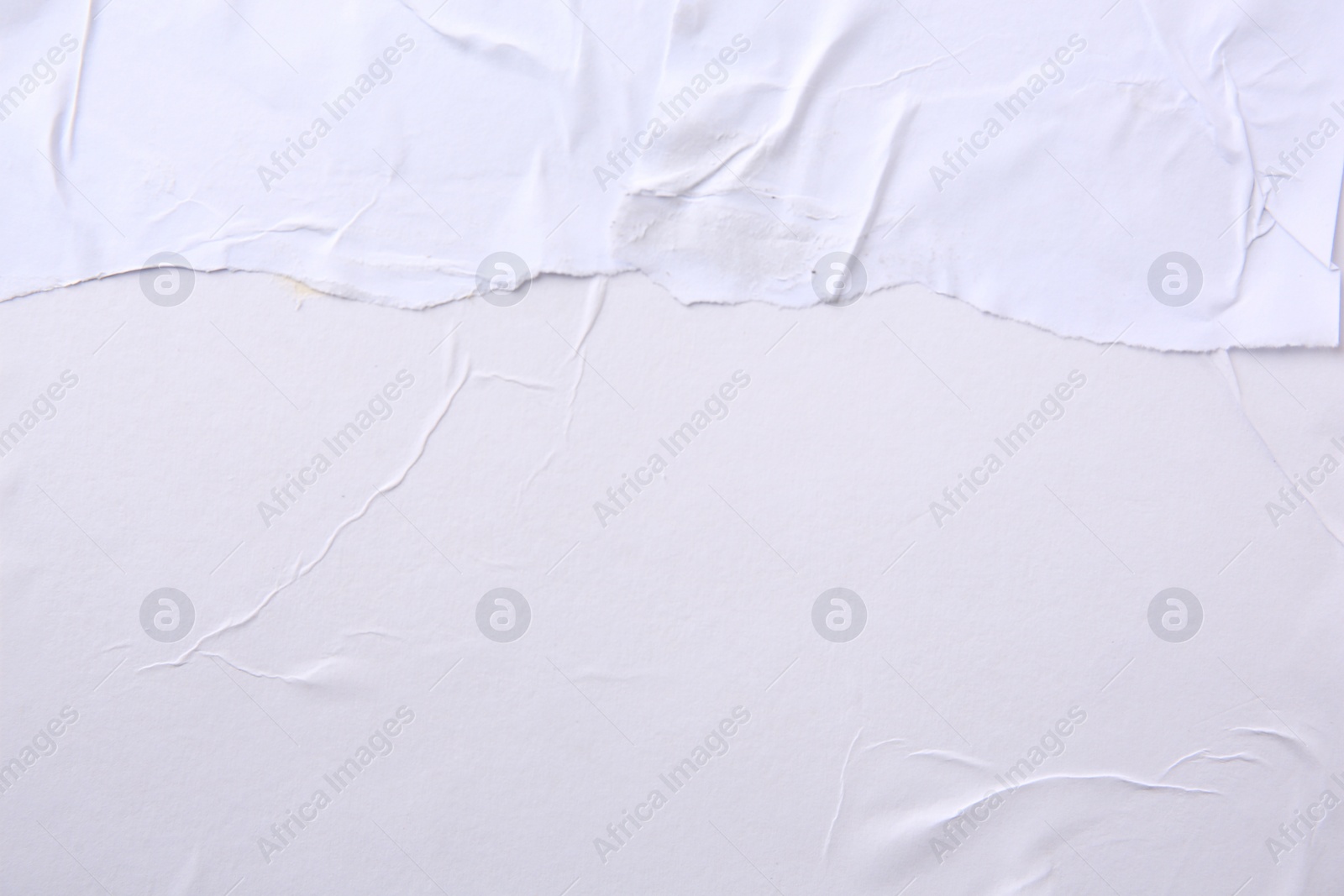 Photo of Texture of white torn paper poster, top view. Space for text