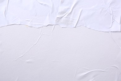 Photo of Texture of white torn paper poster, top view. Space for text