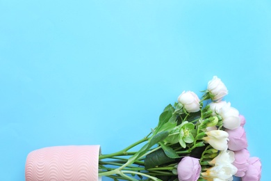 Photo of Bouquet of beautiful flowers on color background, top view