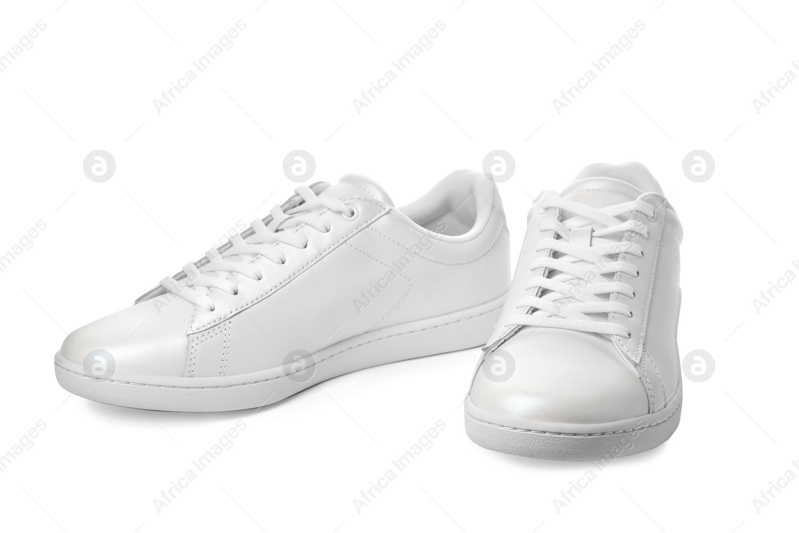 Photo of Pair of trendy sneakers on white background