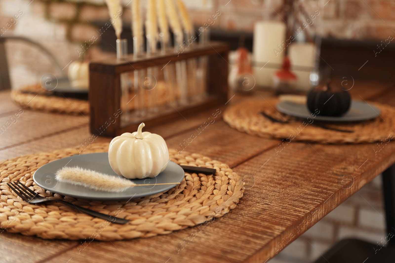 Photo of Wooden table decorated for Halloween in kitchen