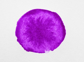 Photo of Blot of purple ink on white background, top view