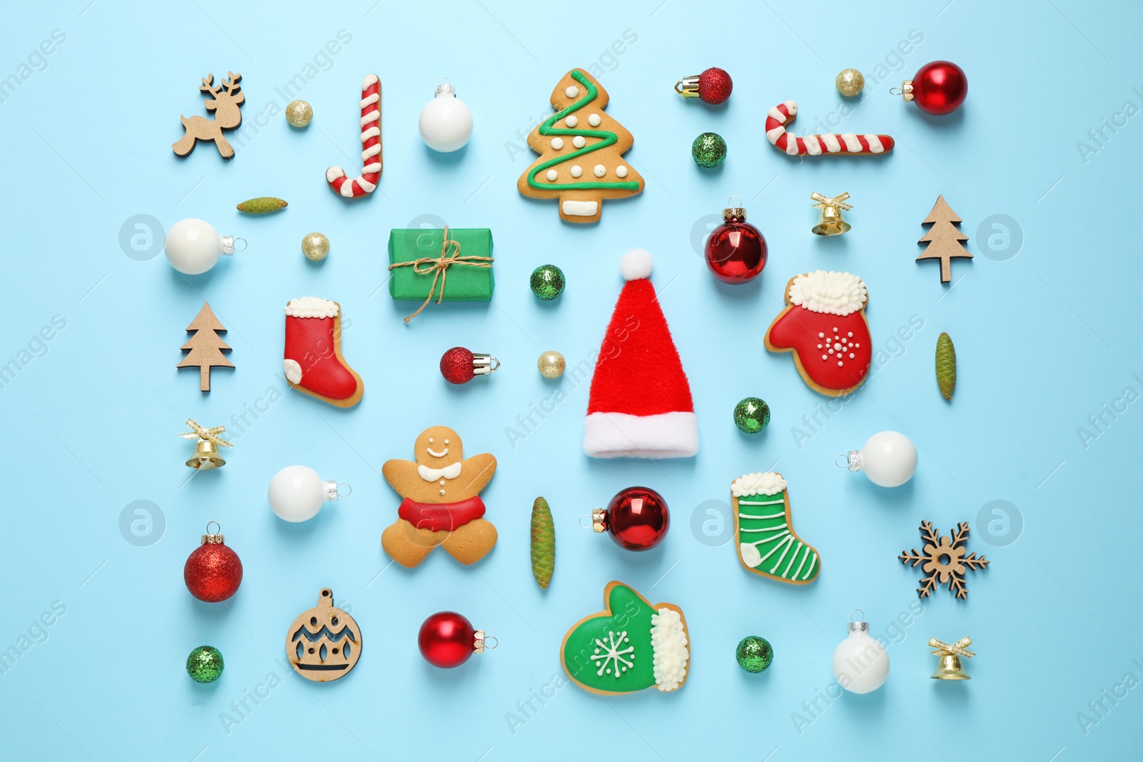 Photo of Flat lay composition with Christmas decorations on light blue background