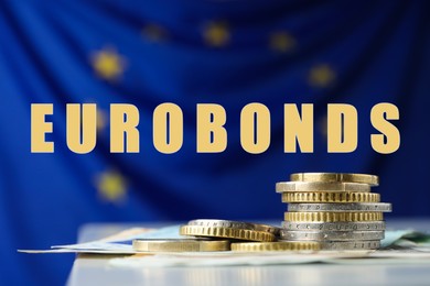 Word Eurobonds, coins and banknotes on table