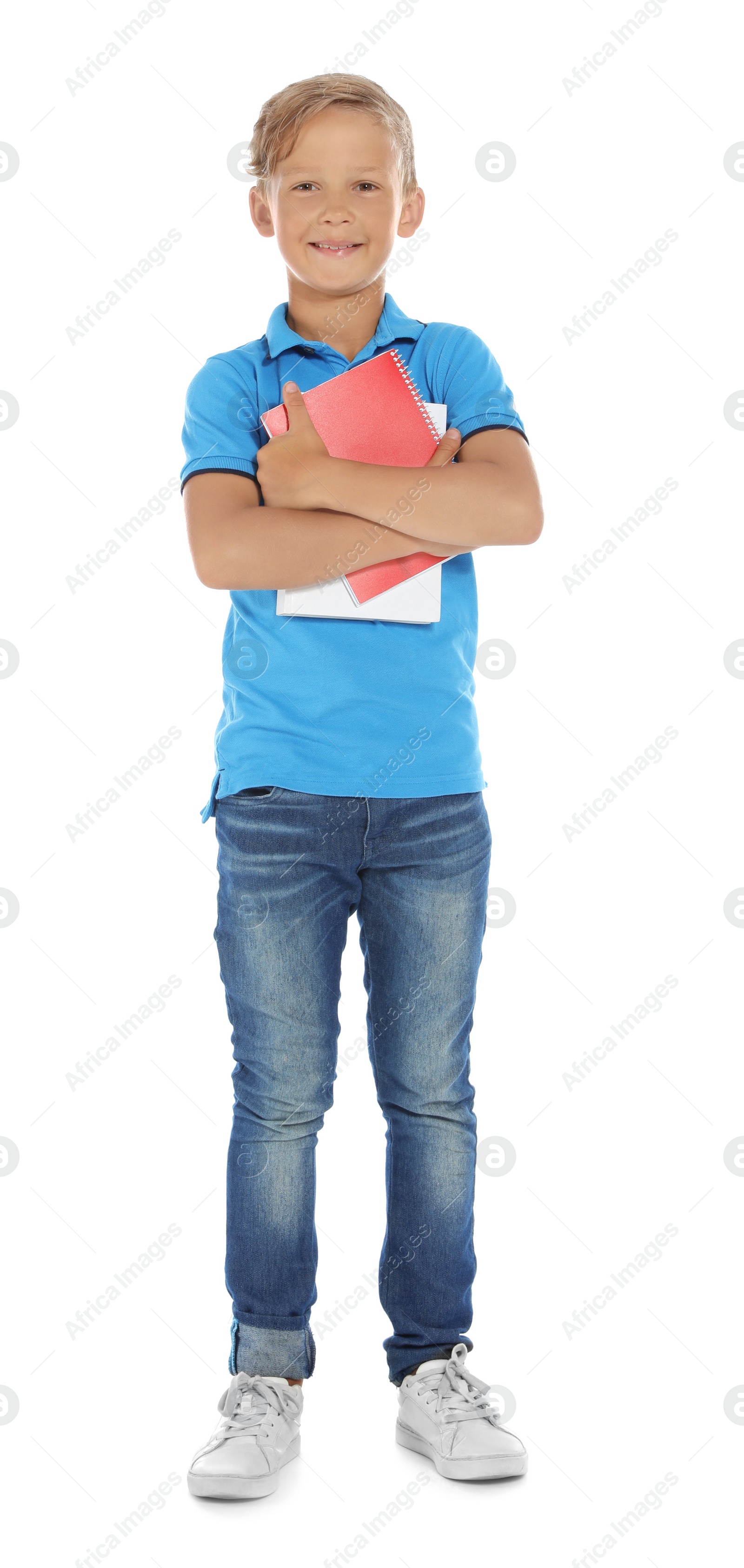 Photo of Little child with school supplies on white background