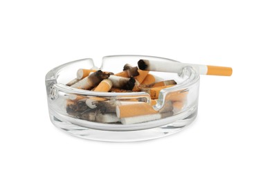 Glass ashtray with cigarette stubs isolated on white