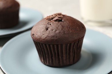 Delicious cupcake with chocolate crumbles on plate, closeup