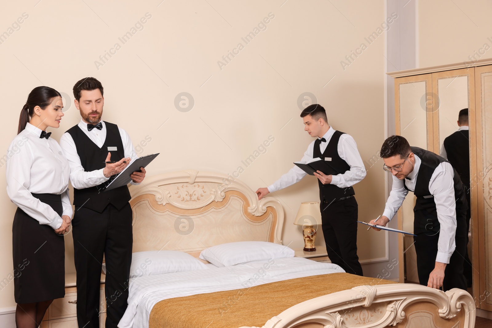 Photo of Group of people attending professional butler courses in hotel