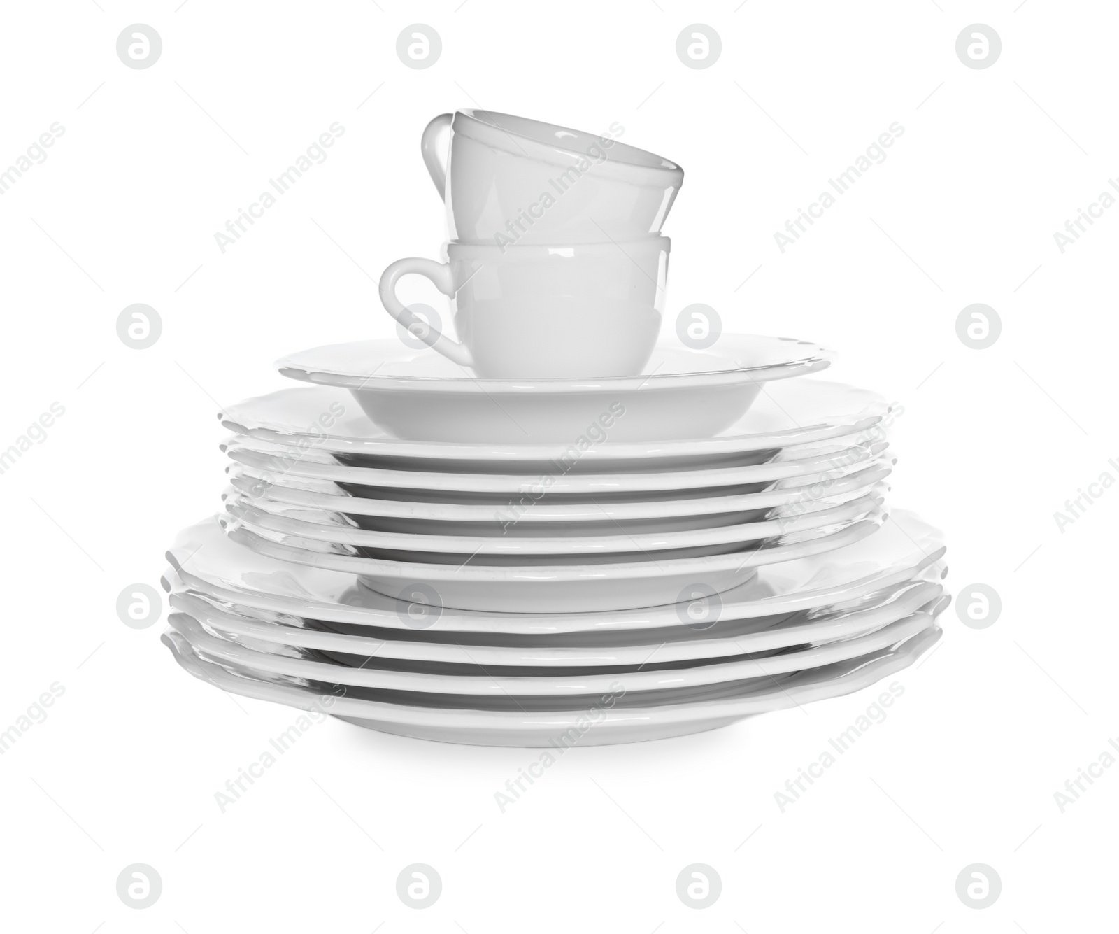 Photo of Stacked plates and cups on white background